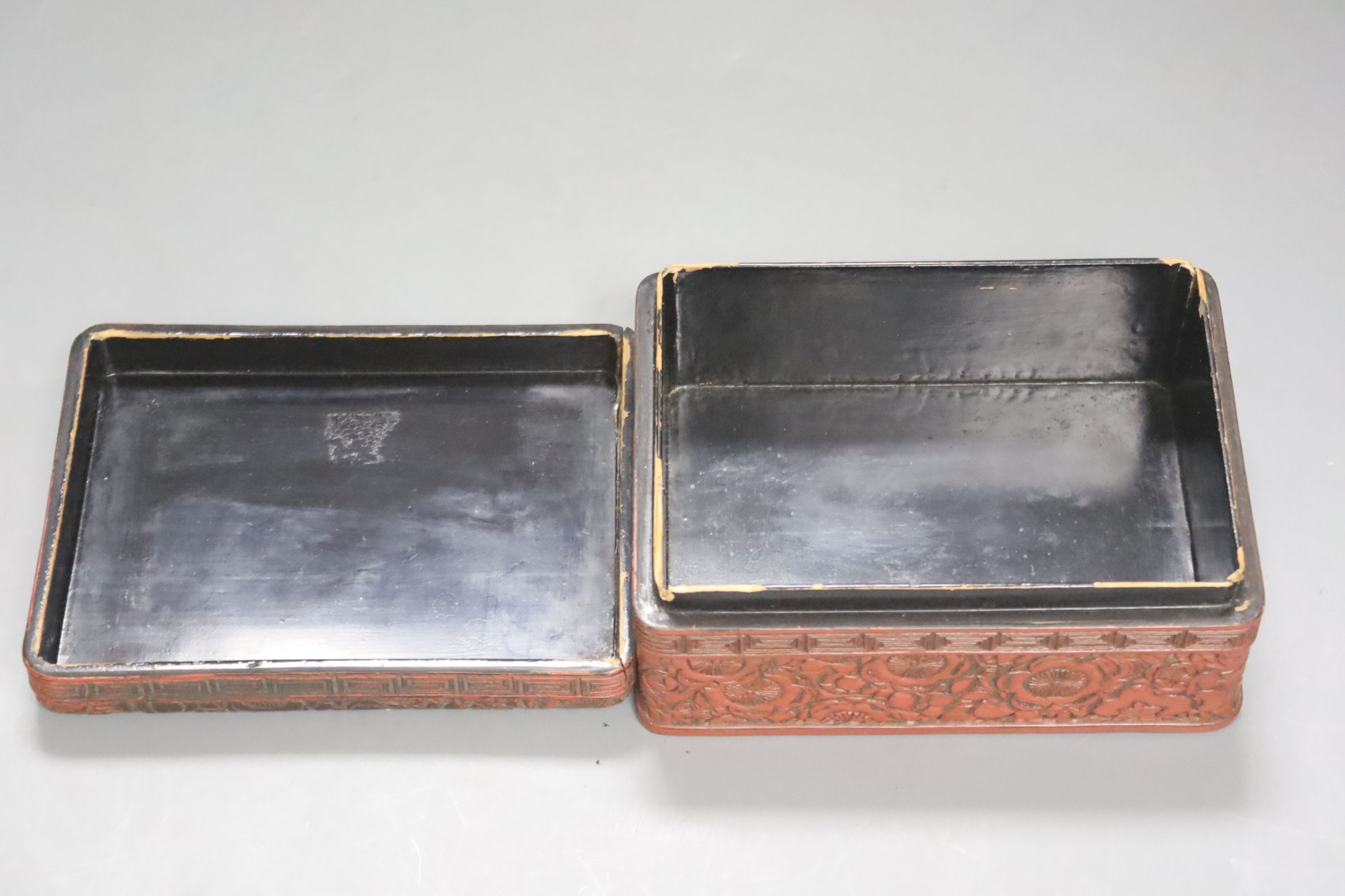 A Chinese cinnabar lacquer box and cover, length 14cm